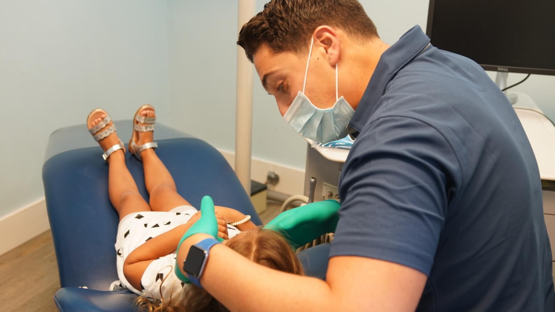 Dr. Izzy seeing a new patient - Izzy's Kidz Dentistry